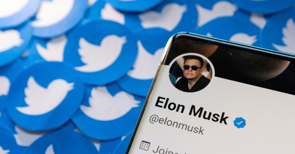 Elon Musk's Twitter profile is seen on a smartphone placed on printed Twitter logos in this picture illustration taken on April 28, 2022. File Photo / Reuters