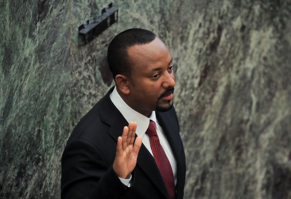 Ethiopia's Prime Minister Abiy Ahmed takes oath during his incumbent ceremony at the Parliament building in Addis Ababa, Ethiopia, on October 4, 2021. REUTERS/Tiksa Negeri/File Photo