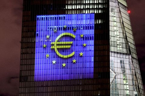 A symphony of light consisting of bars, lines and circles in blue and yellow, the colours of the European Union, illuminates the south facade of the European Central Bank (ECB) headquarters in Frankfurt, Germany, December 30, 2021. REUTERS/Wolfgang Rattay/File Photo