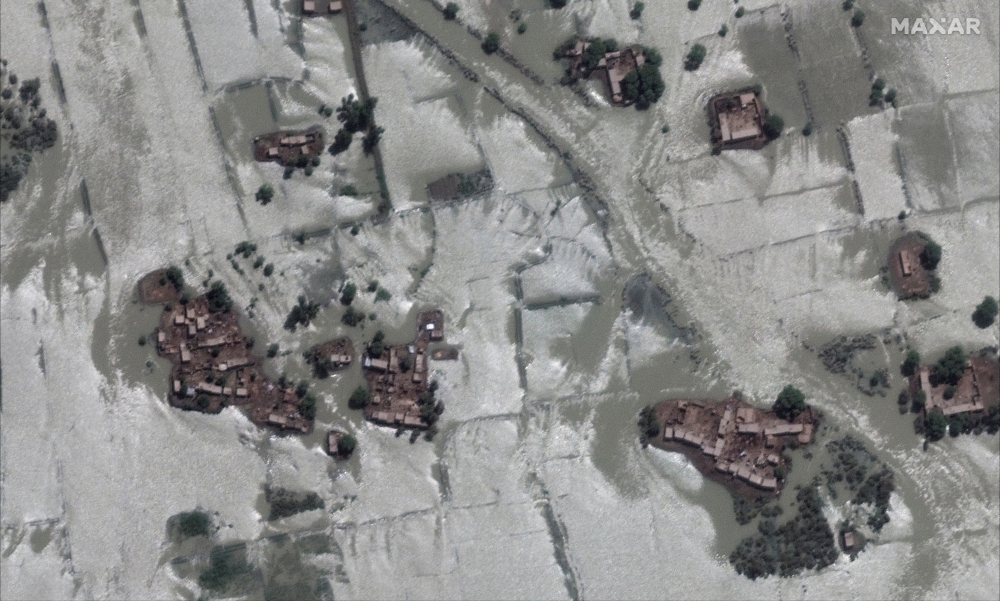 A close up view shows homes and fields during flooding, in Rajanpur, Pakistan, August 28, 2022. Maxar Technologies/Handout via REUTERS