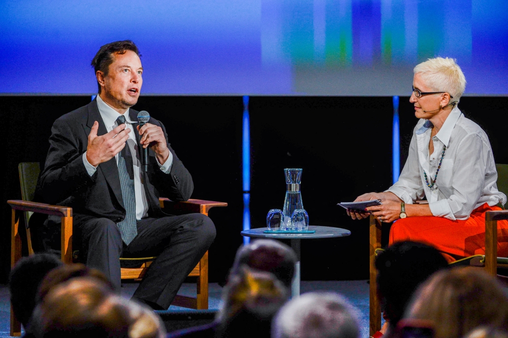 Tesla founder Elon Musk speaks with moderator Xenia Wicket during the opening of Offshore Northern Seas 2022 in Stavanger, Norway, on August 29, 2022. NTB/Carina Johansen via REUTERS 