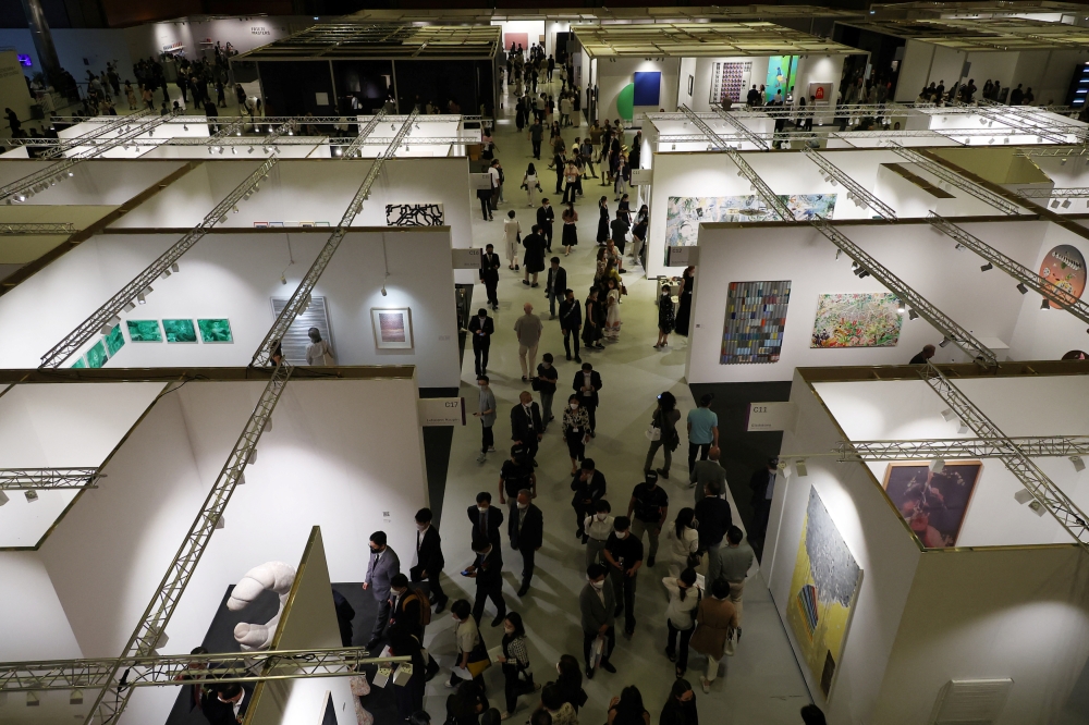 Visitors take a look around at the Frieze art fair, in Seoul, South Korea, September 2, 2022. REUTERS/Kim Hong-Ji