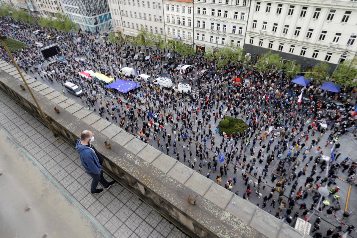 A man watches as demonstrators attend an anti-government protest in Prague, Czech Republic, on April 29, 2021. File Photo / Reuters
