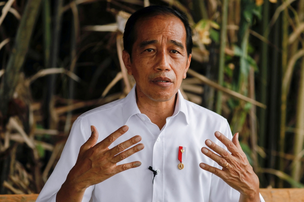 Indonesian President Joko Widodo gestures during an interview in Bebatu, near Tarakan, North Kalimantan province, Indonesia, October 19, 2021. REUTERS/Willy Kurniawan/File Photo