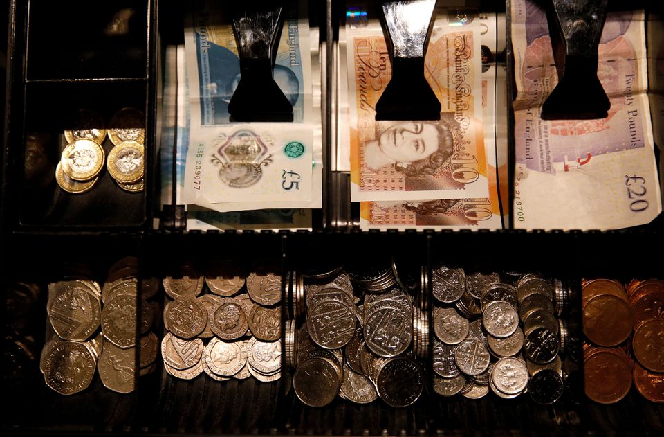 Pound Sterling notes and change are seen inside a cash register in a coffee shop in Manchester, Britain, on September 21, 2018.  File Photo / Reuters