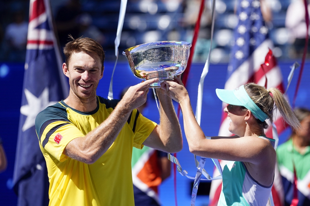 John Peers, left, and Storm Sanders, both of Australia, with the mixed doubles trophy of the 2022 U.S. Open tennis tournament at USTA Billie Jean King Tennis Center in Flushing, New York, on September 10, 2022.   Mandatory Credit: Danielle Parhizkaran-USA TODAY Sports