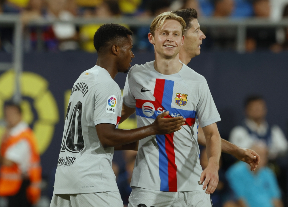 FC Barcelona's Ansu Fati (left) celebrates scoring their third goal with Frenkie de Jong during the La Liga match against Cadiz at the Estadio Nuevo Mirandilla, Cadiz, Spain,  on September 10, 2022.   REUTERS/Marcelo Del Pozo