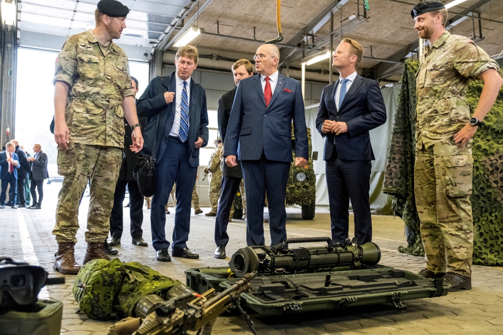 Denmark's Foreign Minister Jeppe Kofod and Polish Foreign Minister Zbigniew Rau visit Almegaard Barracks on the island of Bornholm, Denmark,on September 13, 2022. (Ritzau Scanpix/Pelle Rink via REUTERS)