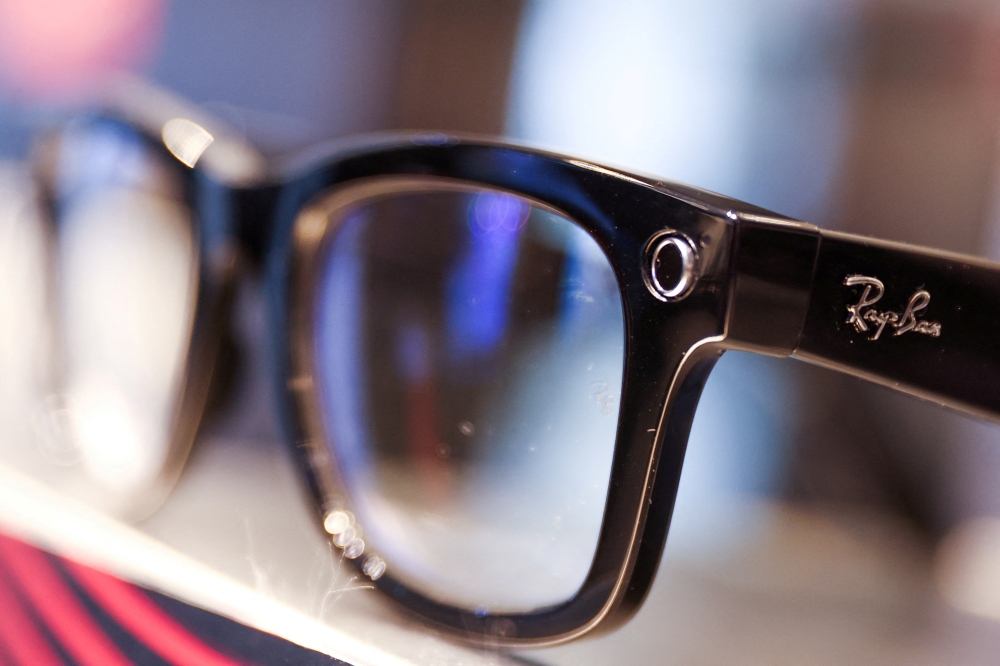File Photo: A Ray-Ban sunglass frame is pictured for sale in a Sunglass Hut, both brands owned by EssilorLuxottica SA, in Manhattan, New York City, US, on November 30, 2021. (REUTERS/Andrew Kelly)