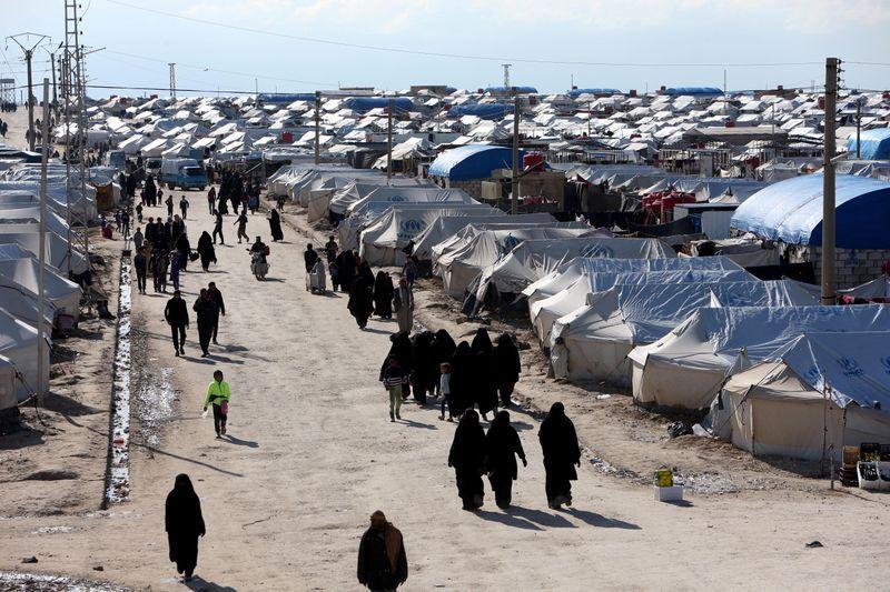 Women walk through al-Hol displacement camp in Hasaka governorate, Syria, on April 1, 2019.  File Photo / Reuters
