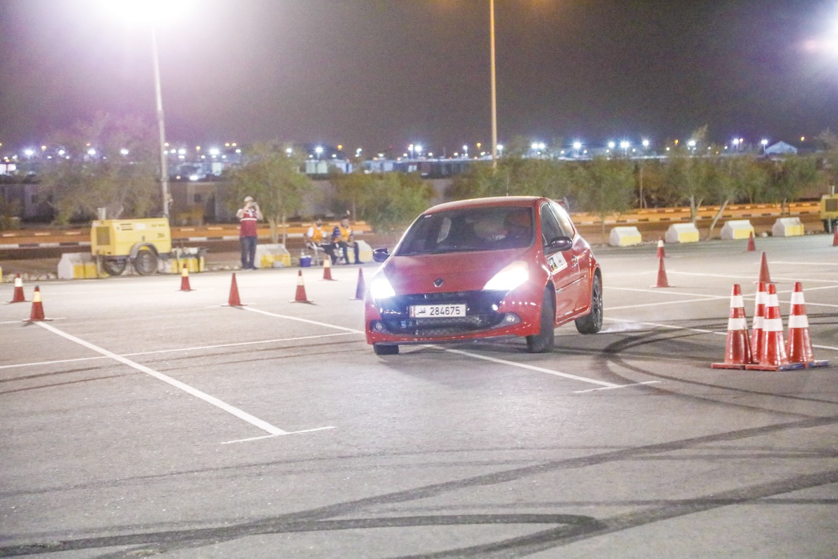 The podium winners of the Production Class 1 with Qatar Motor & Motorcycle Federation Executive Director Amro Al Hamad.