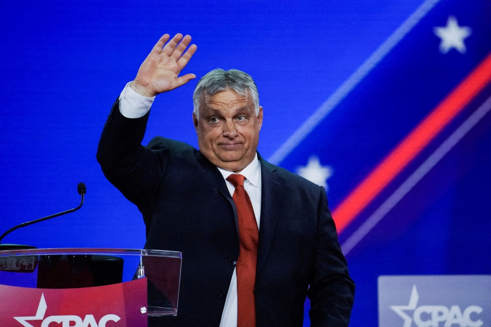 Prime Minister of Hungary Viktor Orban waves at the audience during general session at the Conservative Political Action Conference (CPAC) in Dallas, Texas, U.S., August 4, 2022. Reuters/Go Nakamura/File Photo