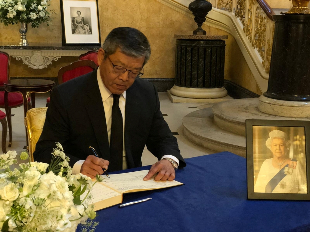 Kelly Hsieh, Taiwan's representative in London, signs the condolence book for Britain's Queen Elizabeth at Lancaster House in London, Britain, in this undated handout image released on September 18, 2022. Taiwan Ministry of Foreign Affairs/Handout via REUTERS