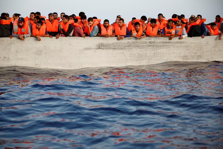 Migrants wait in a boat during a search and rescue operation by the NGO Proactiva Open Arms Uno rescue boat in central Mediterranean Sea, August, 17, 2022.  File Photo/Reuters
