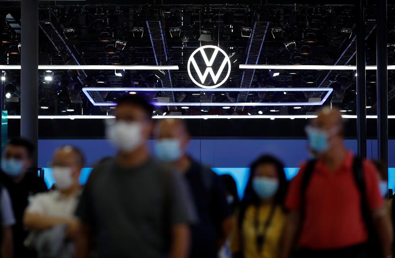 People walk past the Volkswagen booth at the Beijing International Automotive Exhibition, or Auto China show, in Beijing, China on September 26, 2020. File Photo / Reuters
