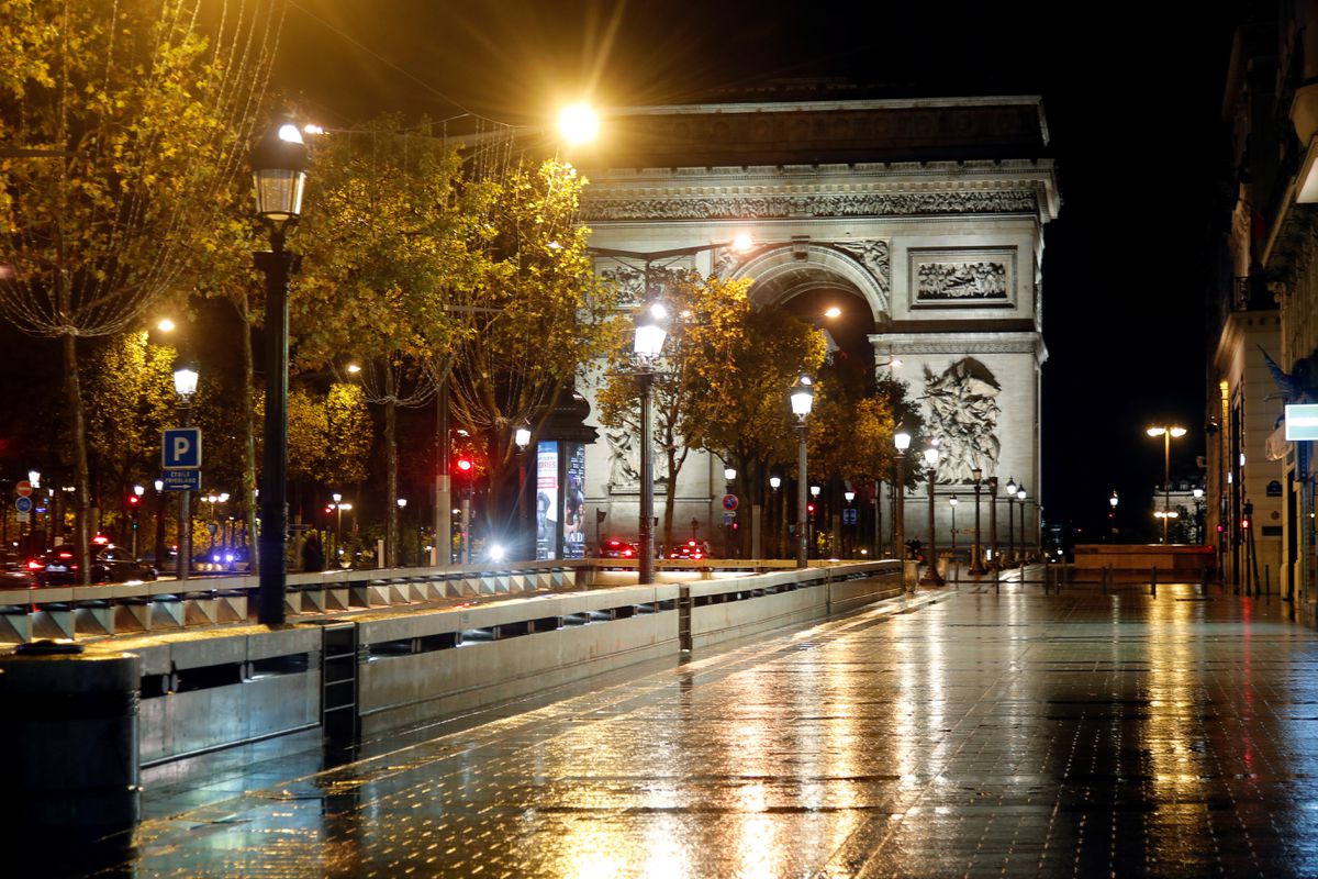 File Photo: A deserted Champs-Elysees avenue is seen near the Arc de Triomphe during the nightly curfew imposed to curb the spread of the coronavirus disease in Paris, France, on October 27, 2020. (REUTERS/Charles Platiau)