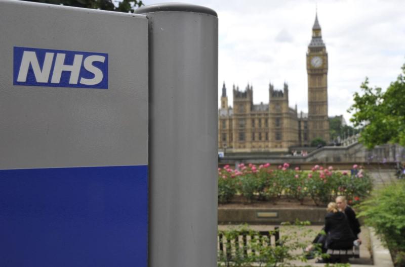 A National Health Service (NHS) sign is seen in the grounds of St Thomas' Hospital, in front of the Houses of Parliament, in London on June 7, 2011. File Photo / Reuters


