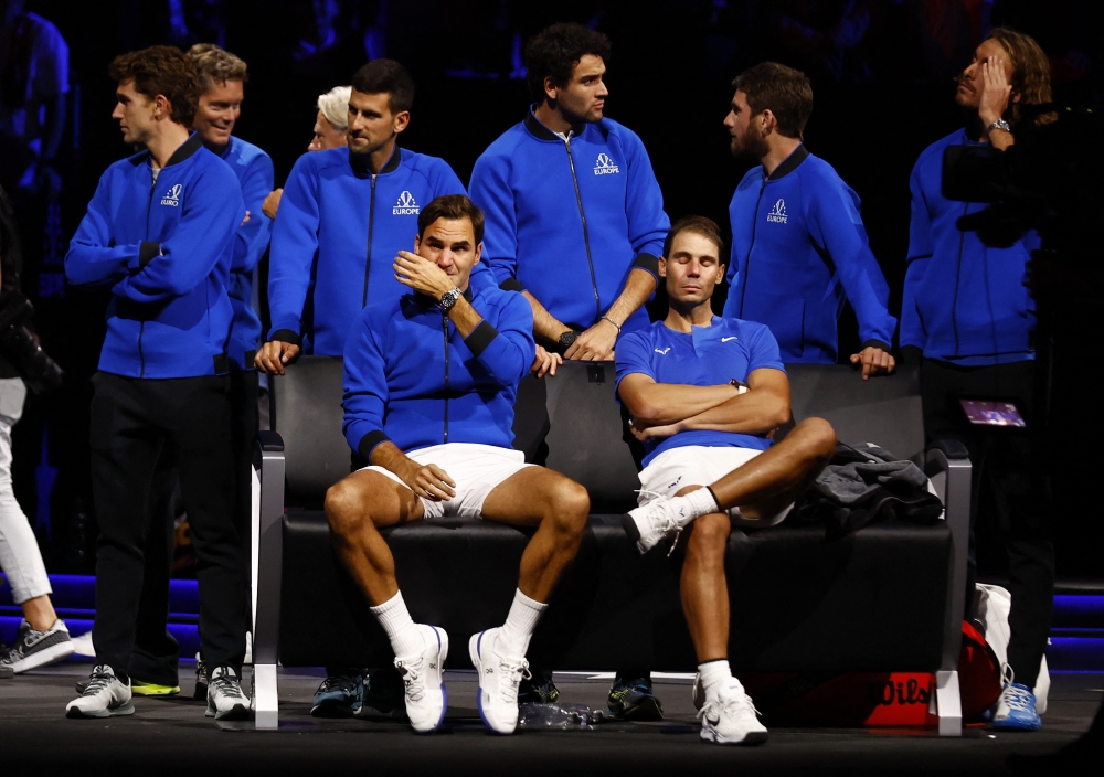 Team Europe's Roger Federer with Rafael Nadal at the end of his last match after announcing his retirement Reuters/Andrew Boyers