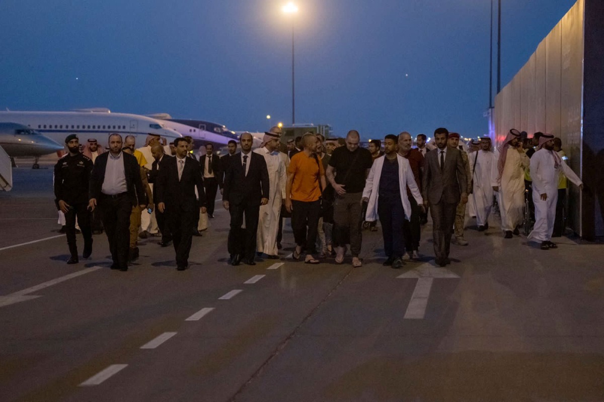 Prisoners of war (five British citizens, one Moroccan, one Swede, one Croat, and two Americans) are seen in the tarmac after arriving, following successful mediation efforts by Saudi Arabia's Crown Prince Mohammed bin Salman, from Russia to King Khalid International Airport, in Riyadh, Saudi Arabia, on September 21, 2022.