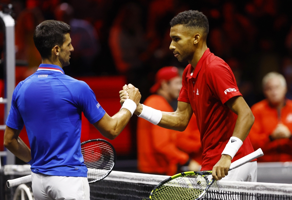 Team Europe's Novak Djokovic shakes hands with Team World's Felix Auger Aliassime after their Laver Cup match at the 02 Arena in London on September 25, 2022.   Action Images via Reuters/Andrew Boyers