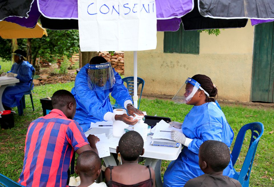 File Photo: Ugandan health workers speak to civilians before carrying out the first vaccination exercise against the Ebola virus in Kirembo village, near the border with the Democratic Republic of Congo in Kasese district, Uganda, on June 16, 2019. (REUTERS/James Akena)