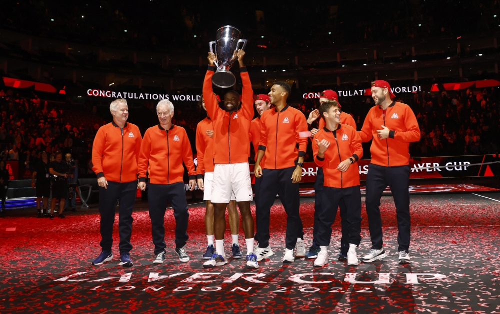 Team World's Frances Tiafoe celebrates with the trophy after winning the Laver Cup at the 02 Arena in London on September 25, 2022.   Action Images via Reuters/Andrew Boyers