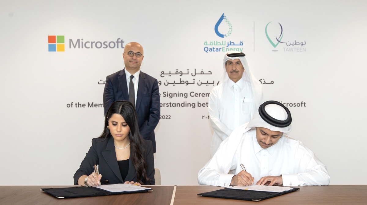 Abdulaziz Al Mannai (front right), Executive Vice-President, Human Capital of QatarEnergy and Lana Khalaf (front left), Country General Manager at Microsoft Qatar sign the Mou, as Abdulaziz Al Muftah, Executive Vice-President, Industrial Cities of QatarEnergy and Samer Abu Ltaif, Corporate Vice-President and President of Microsoft Mea region look on. 