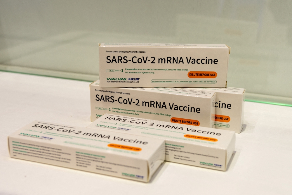 Boxes of Walvax Biotechnology's messenger RNA (mRNA) vaccine against the coronavirus disease (COVID-19) are seen displayed at a trade fair in Shanghai, China April 16, 2021. China Daily via REUTERS
