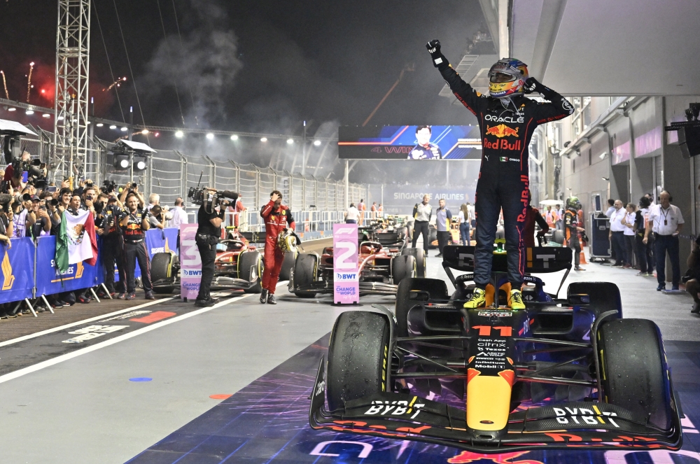 Red Bull's Sergio Perez celebrates after winning the Singapore Grand Prix at the Marina Bay Street Circuit, Singapore, on October 2, 2022. (REUTERS/Caroline Chia)