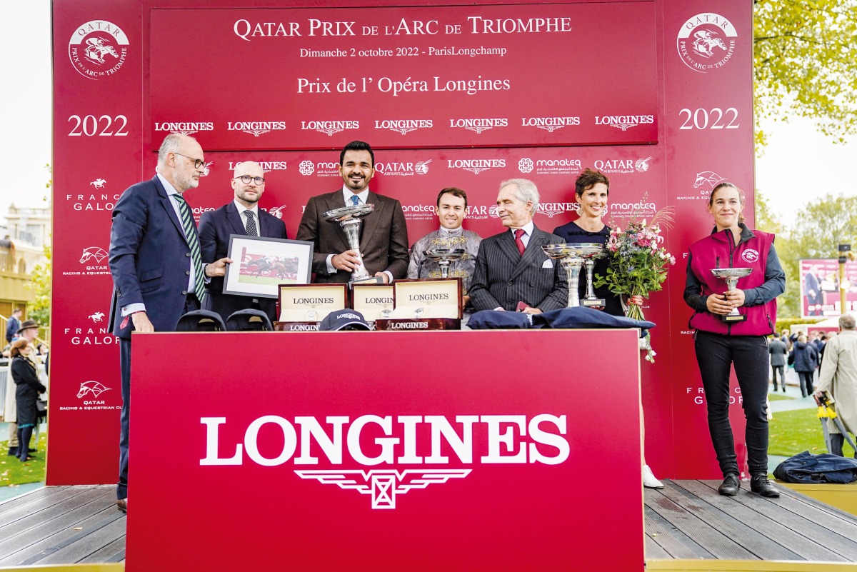 Qatar Olympic Committee President H E Sheikh Joaan bin Hamad Al Thani receives the Prix de l’Opera Longines trophy following the Gr1 victory of Al Shaqab Racing’s Place Du Carrousel at the ParisLongchamp racecourse, yesterday.