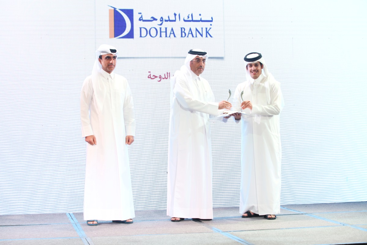Minister of Labor H E Dr. Ali bin Smaikh Al Marri presents the award to Sheikh Abdulrahman bin Fahad Al Thani, Deputy Chief Executive Officer of Doha Bank, during the ceremony in Doha, recently. 
