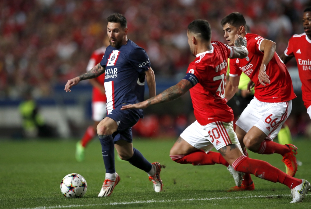 Paris St Germain's Lionel Messi in action against Benfica players during their Champions League Group H match at the Estadio da Luz, Lisbon, Portugal, on October 5, 2022. 
REUTERS/Pedro Nunes
