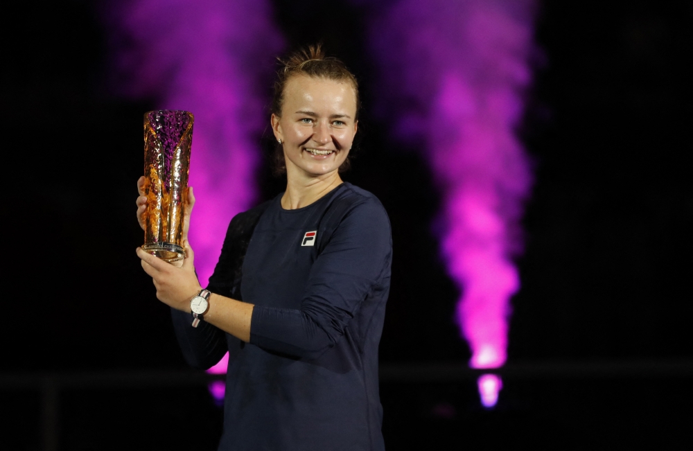 Czech Republic's Barbora Krejcikova celebrates with the trophy after winning the singles final of the Ostrava Open against Poland's Iga Swiatek at the CEZ Arena, Ostrava, Czech Republic, on October 9, 2022. REUTERS/David W Cerny