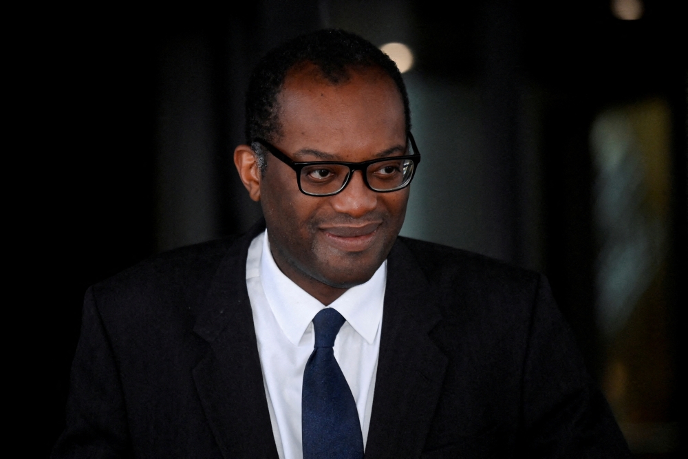British Chancellor of the Exchequer Kwasi Kwarteng walks outside a hotel, as Britain's Conservative Party's annual conference continues, in Birmingham, Britain, October 4, 2022. REUTERS/Toby Melville/File Photo