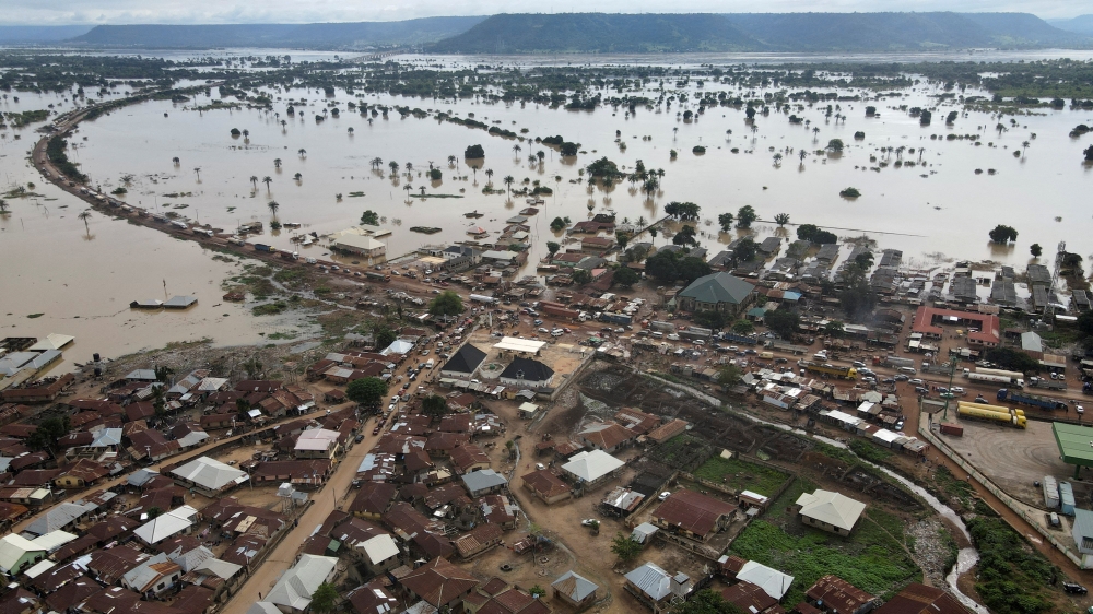 Vehicles are seen on a flooded road in Lokoja, Nigeria October 13, 2022. REUTERS/Ayodeji Oluwagbemiga