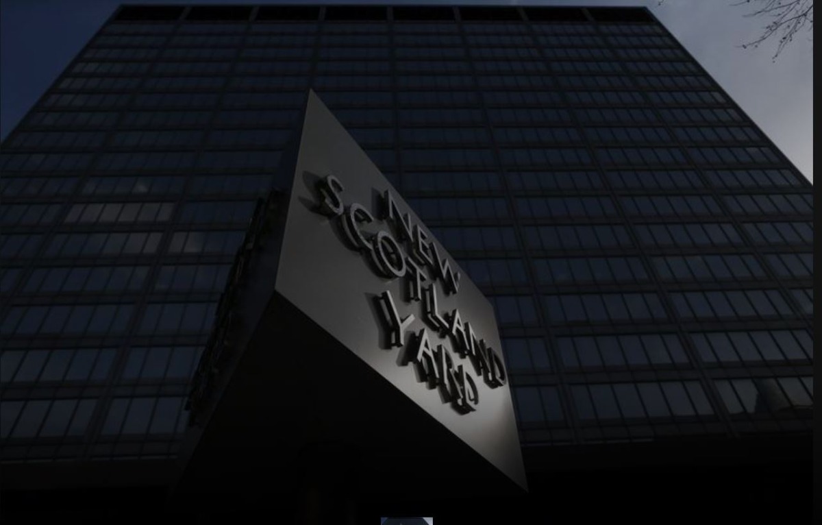 The sign outside New Scotland Yard reflects afternoon sunshine outside the headquarters of the Metropolitan Police in central London on March 6, 2014. File Photo / Reuters
