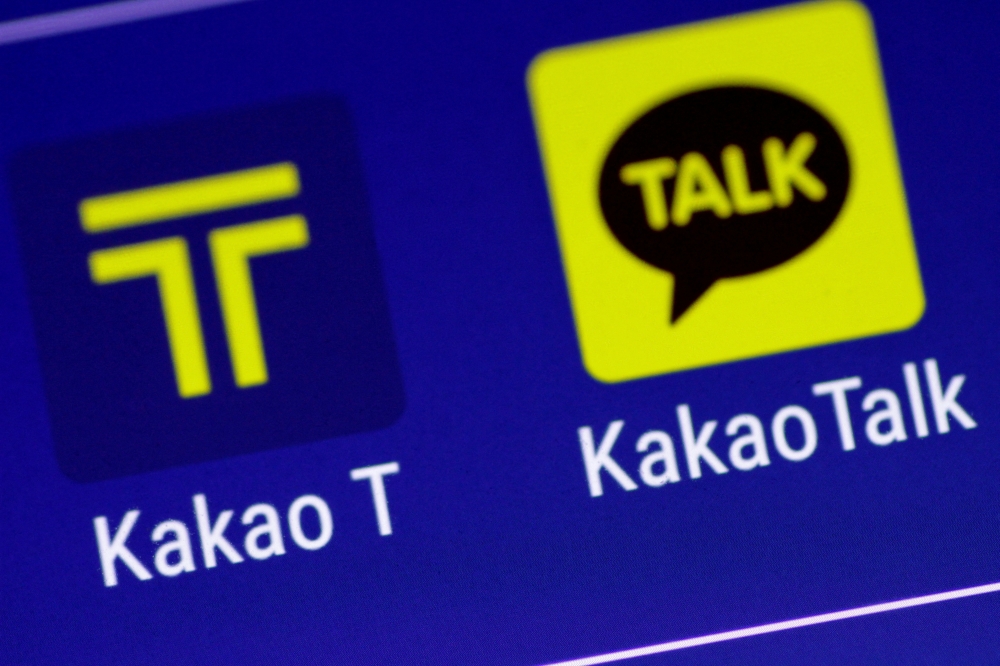 The Kakao messaging application and the Kakao T taxi booking application are seen on a mobile phone in this illustration photo March 13, 2018. REUTERS/Thomas White/Illustration/File Photo