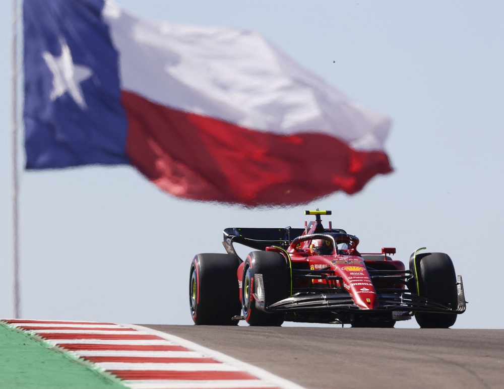 Scuderia Ferrari driver Carlos Sainz (55) passes the Texas flag during practice for the US Grand Prix at Circuit of the Americas in Austin, Texas, on October 21, 2022. Mandatory Credit: Erich Schlegel-USA TODAY Sports