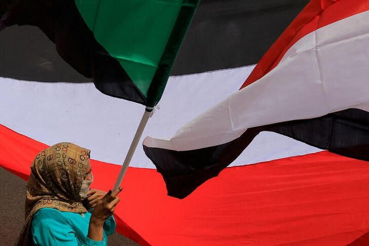 A woman attends a rally calling for an end to ethnic tensions and civil conflict following an escalation of violence in Blue Nile state and Darfur, in Khartoum, Sudan, on July 26, 2022.  File Photo / Reuters