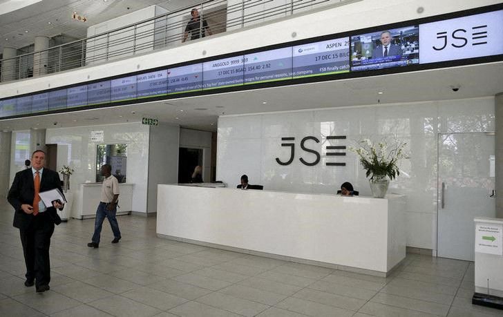 People walk near the reception at the Johannesburg Stock Exchange (JSE) in Sandton, Johannesburg, South Africa, on December 10, 2015.   File Photo / Reuters
