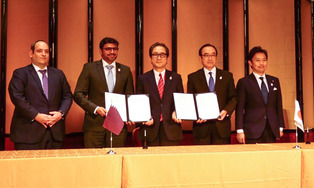 Qatar and Japan officials during the signing ceremony. 