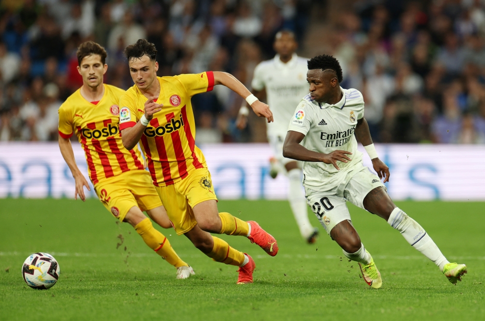 Girona's Arnau Martinez in action with Real Madrid's Vinicius Junior during their LaLiga match at the Santiago Bernabeu, Madrid, Spain, on October 30, 2022.  REUTERS/Isabel Infantes