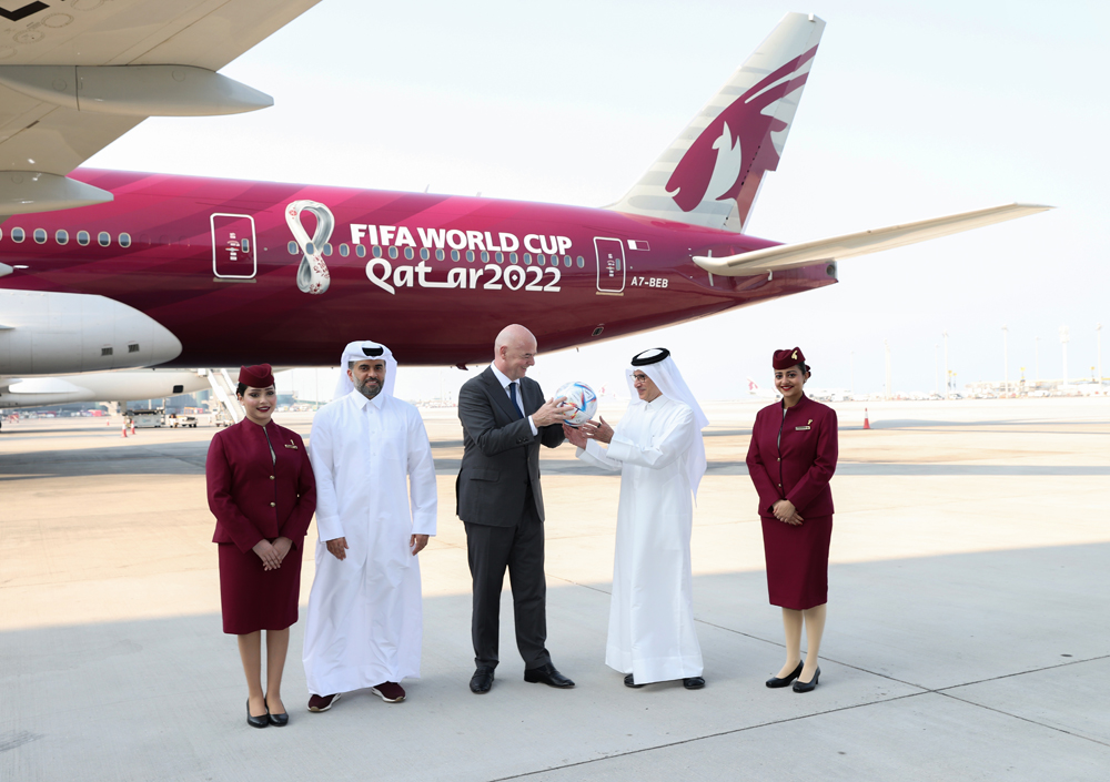 Qatar Airways Group Chief Executive H E Akbar Al Baker (second right), FIFA President Gianni Infantino (centre) and MATAR Chief Operations Officer Engr. Badr Al Meer (second left) along with Qatar Airways crew at Hamad International Airport tarmac. 