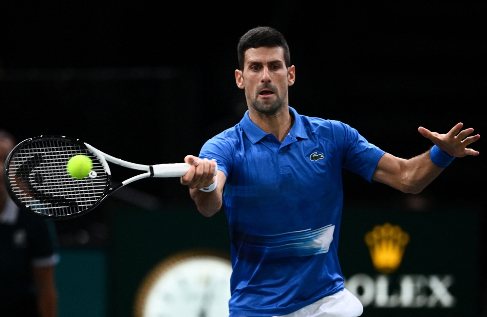 Serbia's Novak Djokovic plays a forehand return during the men's singles match between Serbia's Novak Djokovic and US' Maxime Cressy on day two of the ATP World Tour Masters 1000 - Paris Masters (Paris Bercy) - indoor tennis tournament at The AccorHotels Arena in Paris on November 1, 2022. (Photo by Christophe ARCHAMBAULT / AFP)