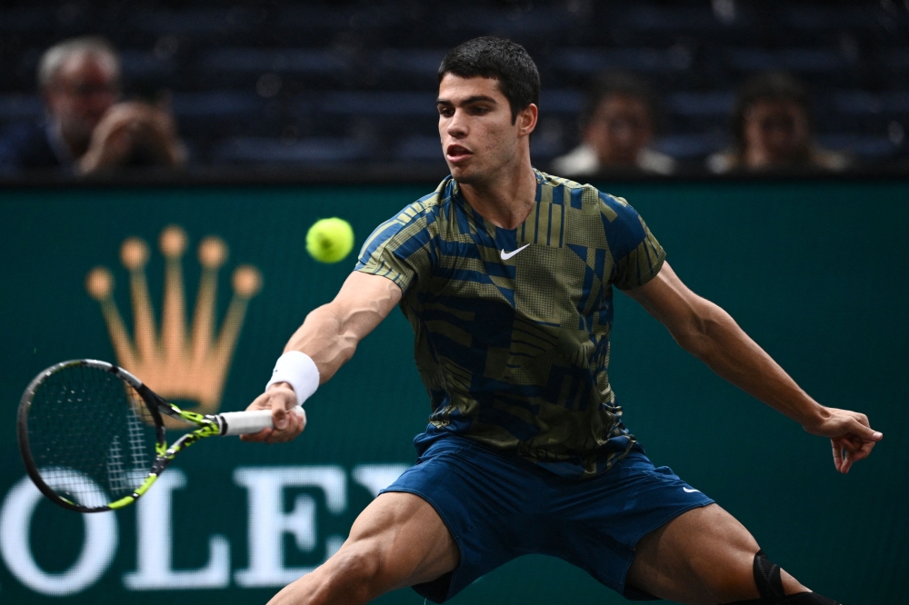 Spain's Carlos Alcaraz Garfia plays a forehand return during the men's singles round of 16 tennis match between Spain's Carlos Alcaraz Garfia and Japan's Yoshihito Nishioka on day three of the ATP World Tour Masters 1000 - Paris Masters (Paris Bercy) - indoor tennis tournament at The AccorHotels Arena in Paris on November 2, 2022. (Photo by Christophe ARCHAMBAULT / AFP)