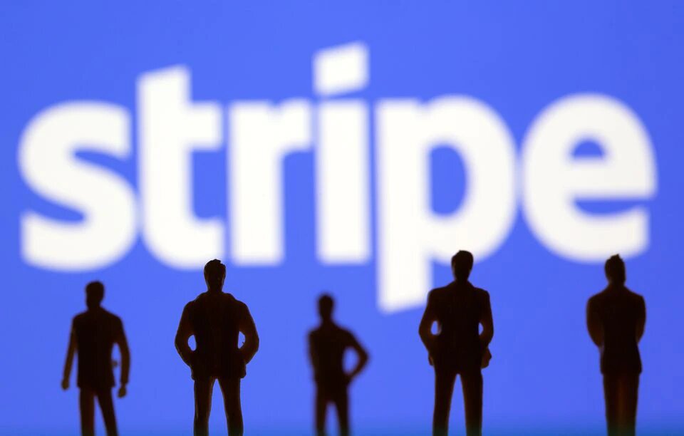 Small toy figures are seen in front of Stripe logo in this illustration picture taken March 15, 2021. File Photo / Reuters

