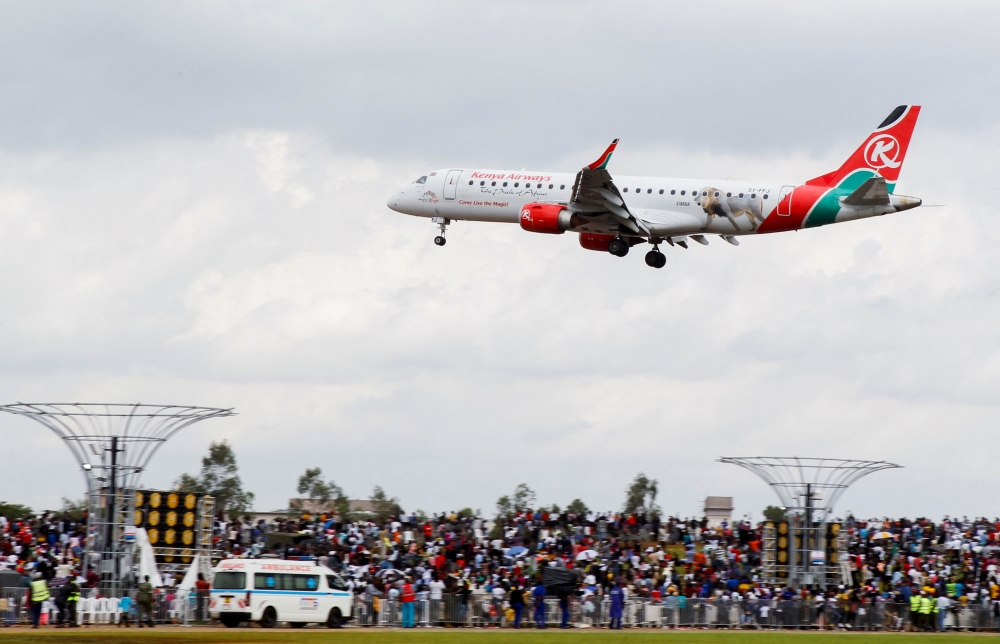 A Kenya Airways passenger Embraer 190 plane manoeuvres at the Kenya Defence Forces (KDF) Museum Air Show Festival in conjunction with the Aero Club at the Uhuru Gardens in Nairobi, Kenya, May 28, 2022. (REUTERS/Monicah Mwangi)