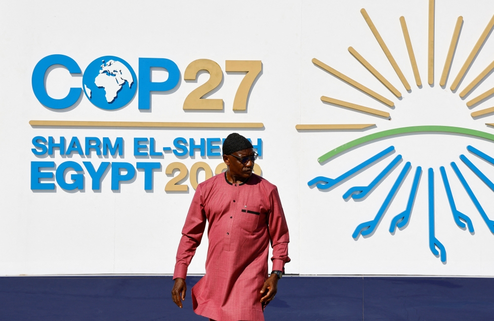 A man walks outside of the Sharm El Sheikh International Convention Centre during the COP27 climate summit opening in Egypt's Red Sea resort of Sharm el-Sheikh, Egypt, on November 6, 2022. REUTERS/Thaier Al-Sudani
 