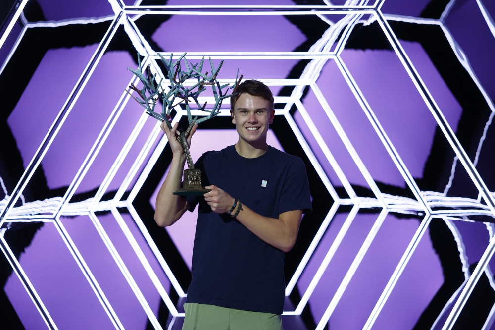 Denmark's Holger Rune celebrates with the trophy after winning the final against Serbia's Novak Djokovic Reuters/Christian Hartmann