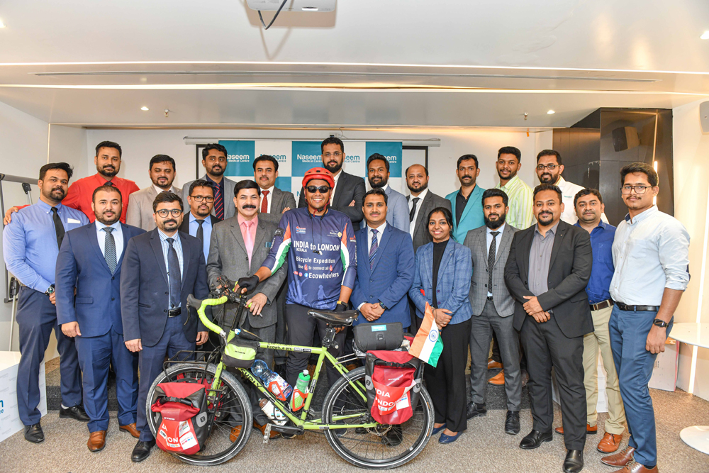 Dr. Munir Ali Ibrahim, General Manager, Naseem Healthcare; Shanavas, GM-Operations, Naseem Healthcare, and others welcome Fayiz Asraf Ali. 